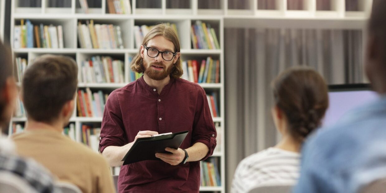 Teacher With Students In The Library